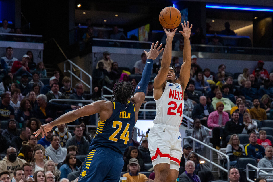Brooklyn Nets guard Cam Thomas shoots the ball against Indiana Pacers guard Buddy Hield in the second half at Gainbridge Fieldhouse.