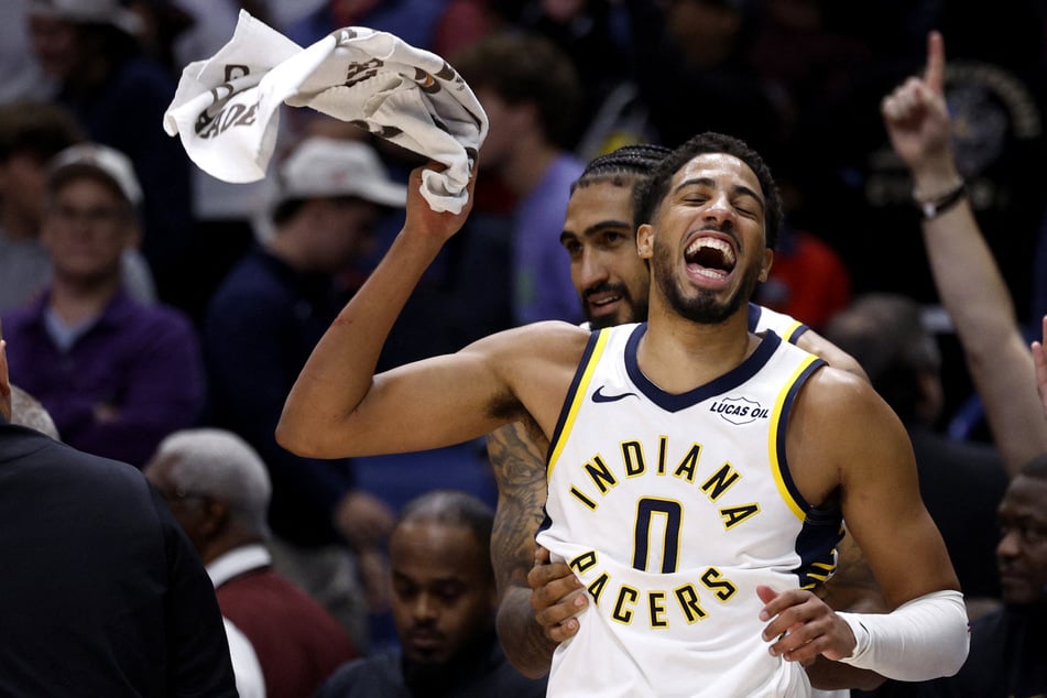 Tyrese Haliburton and Obi Toppin of the Indiana Pacers celebrate a 123-120 win over the New Orleans Pelicans at Smoothie King Center on October 21, 2026.