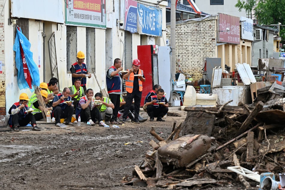 Beijing lifts rain red alert after evacuating over 80,000 people