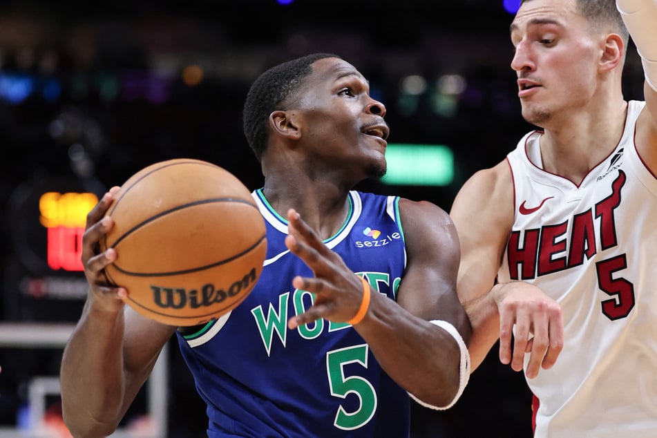 Anthony Edwards #5 of the Minnesota Timberwolves drives to the net against Nikola Jovic #5 of the Miami Heat during the first half at Kaseya Center on October 21, 2026.