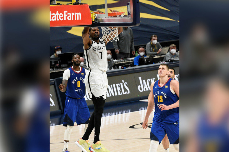 Kevin Durant scoring against the Denver Nuggets in the first round of the NBA playoffs.