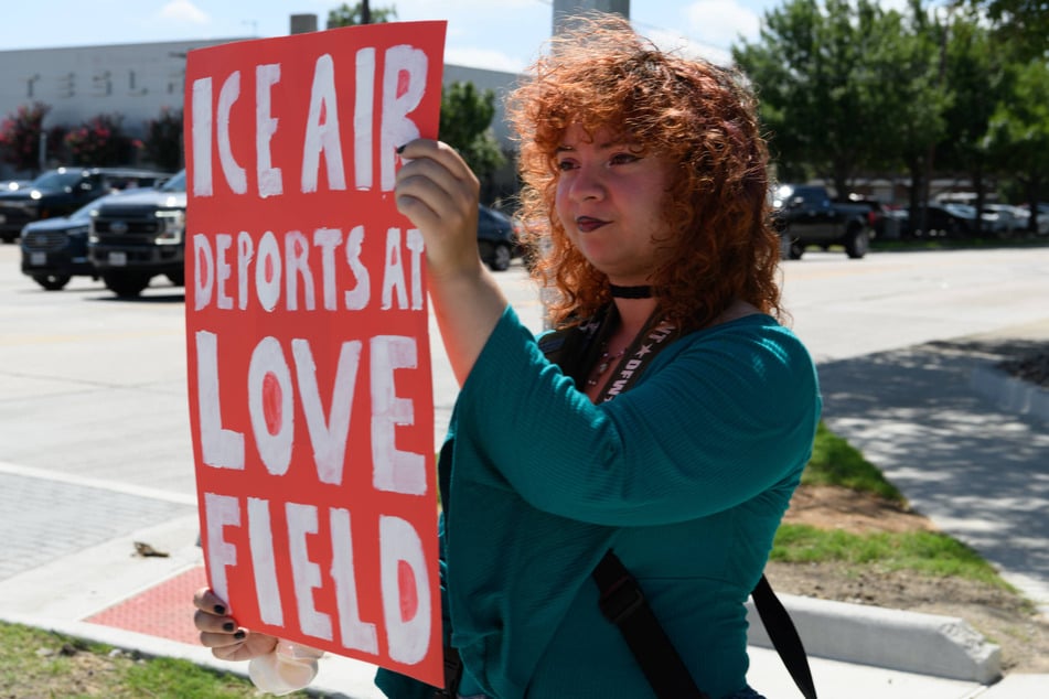 Demonstrators protest against ICE's use of Dallas Love Field in Texas for deportations on June 13, 2026.