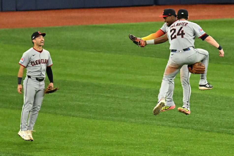 Cleveland Guardians outfielder Steven Kwan, outfielder Angel Martinez, and outfielder Chase DeLauter celebrate winning game one of the ALCS against the Tampa Bay Rays.