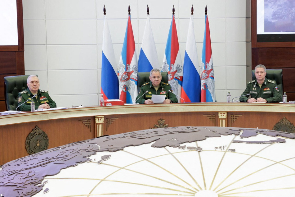 Russian Defense Minister Sergei Shoigu (c.) confirmed Russia had delivered its nuclear-capable Iskander missile system to neighboring Belarus.