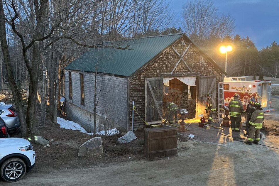 Firefighters and rescue workers provide medical care at the scene of the wedding floor collapse.