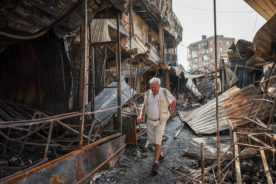 A man walks through debris of a demolished market, which was hit during a Russian missile and drone attack, in Kyiv, Ukraine, on May 25, 2026.
