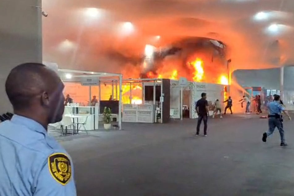 Emergency crews battle a fire that broke out at a pavilion inside the COP30 venue in Belem, Brazil, on November 20, 2025.