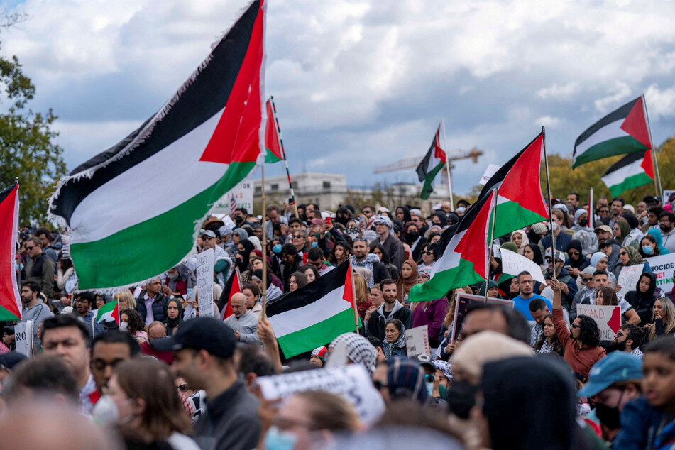 Activists gather en masse to rally for a ceasefire in Gaza and Palestinian liberation near the Washington Monument.