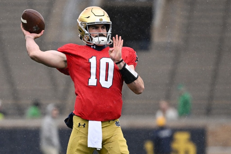 Notre Dame quarterback Sam Hartman went 19-for-23 passes for 251 yards and four touchdowns against Navy.