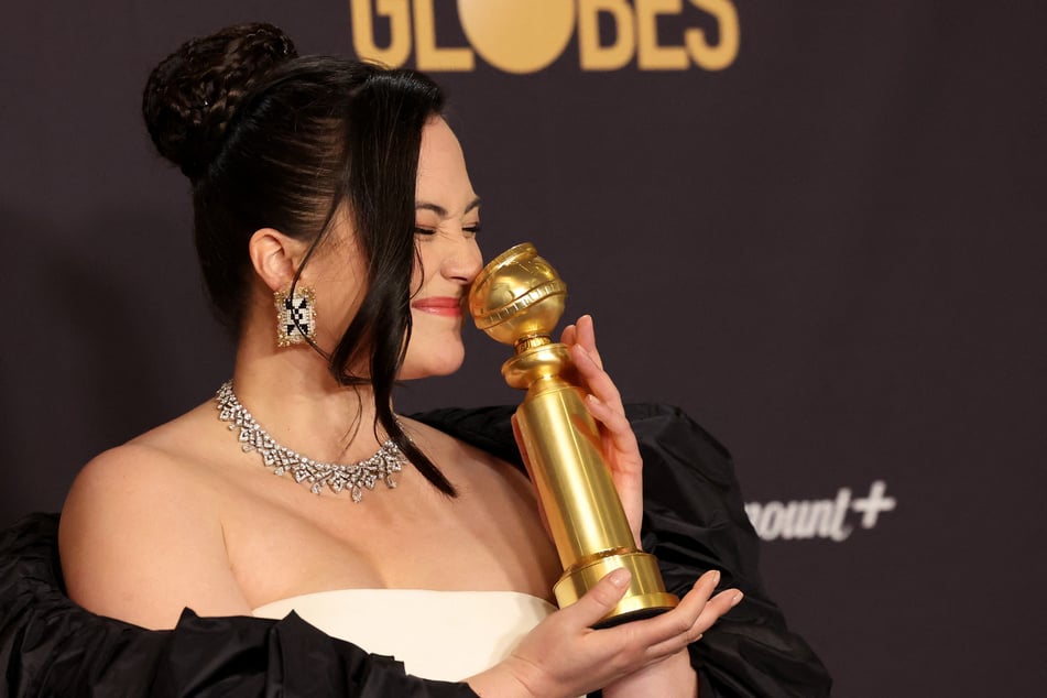Lily Gladstone poses with the award for Best Performance by a Female Actor in a Motion Picture Drama for Killers of the Flower Moon.