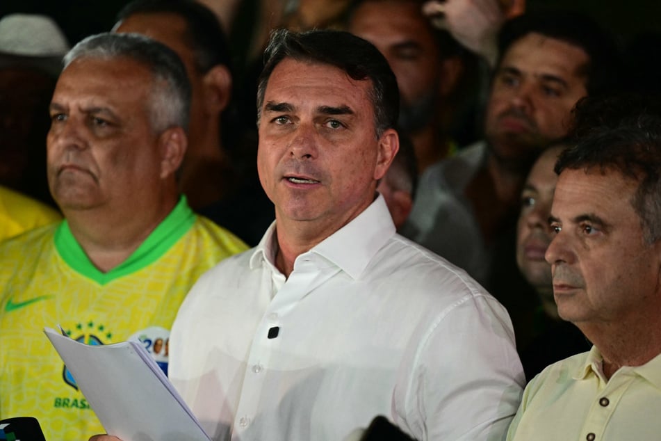 Liberal Party presidential candidate Flavio Bolsonaro reacts after knowing the first results in the runoff election, in Brasilia, Brazil, on October 25, 2026.