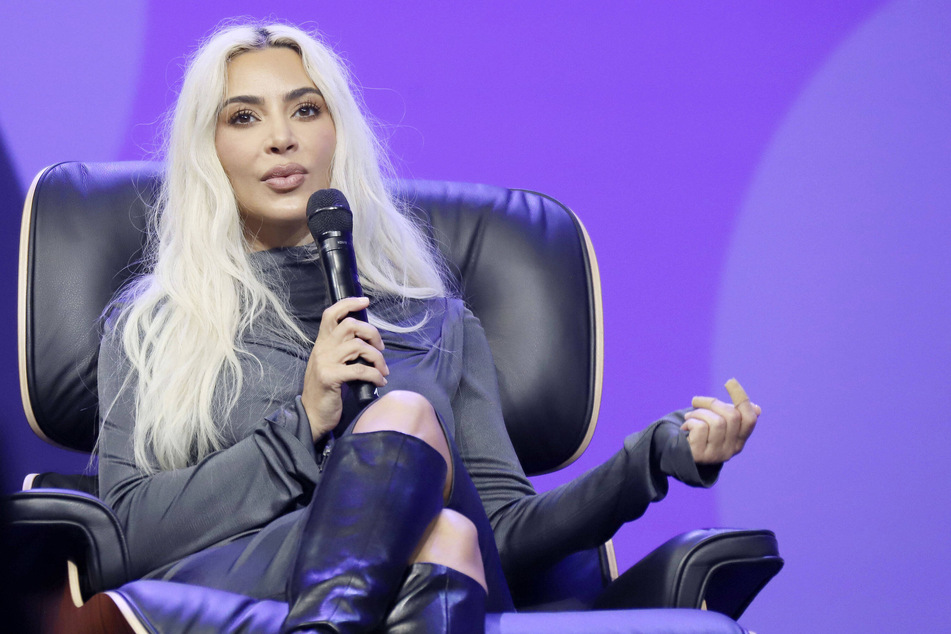 Kim Kardashian (pictured) is said to be unbothered by her recent drama with Tom Brady and Taylor Swift.