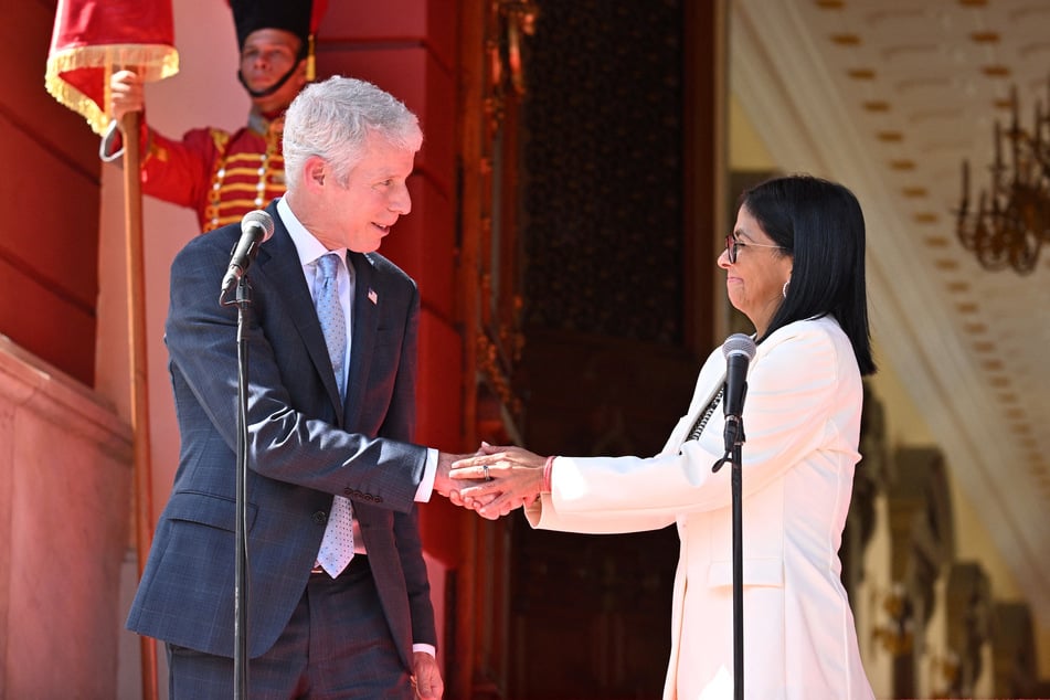 Venezuela's interim President Delcy Rodriguez (r.) and US Energy Secretary Chris Wright (l.) shake hands as they give a press conference after the signing of an oil agreement at the Miraflores Presidential Palace in Caracas on September 2, 2026.