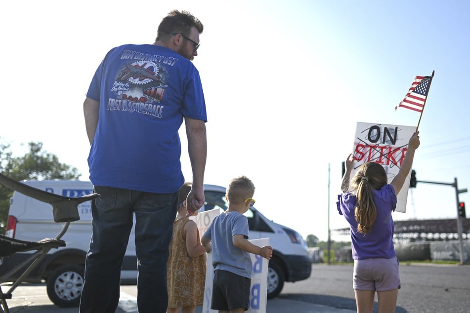 Boeing defense plant workers and their families strike outside of a facility in Berkeley, Missouri.