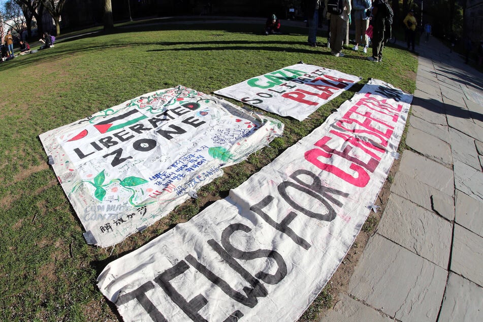 Protest signs are pictured as students at Yale University demonstrate for Palestinian human rights on the quad in front of Sterling Memorial Library.