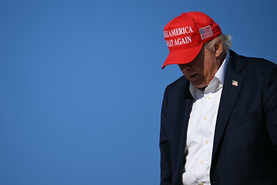 President Donald Trump disembarks Air Force One on Monday. His administration has been dealt a blow in his attempt to share taxpayer information with immigration authorities.