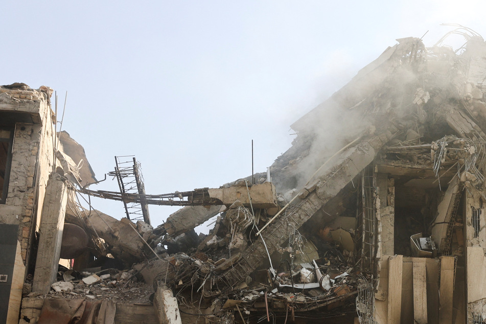 Smoke rises from a damaged building in the aftermath of Israeli strikes in Tehran, Iran, on June 13, 2025.
