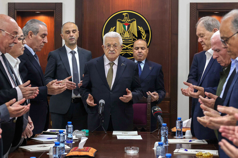 President Mahmoud Abbas (c.) leads prayers next to Hussein al-Sheikh (third from l.) during a meeting of the Palestine Liberation Organization's Executive Committee in Ramallah on April 26, 2025.