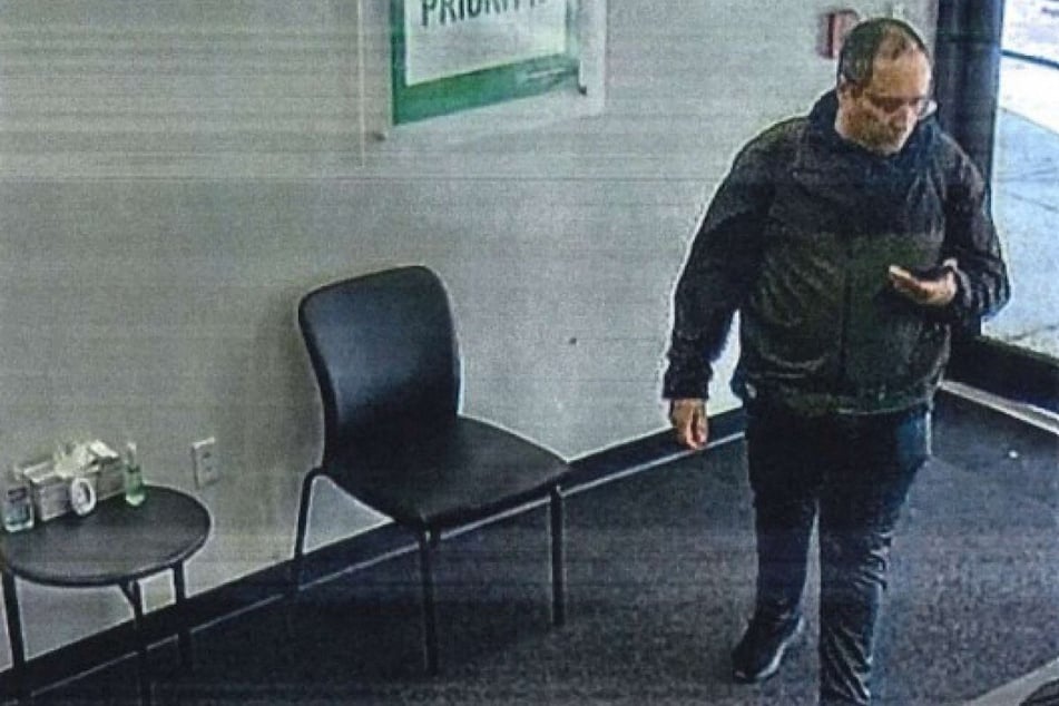 This handout image of CCTV footage released on Thursday in an affidavit by the Providence Police Department shows Claudio Neves Valente, the suspect in the Brown University and Massachusetts Institute of Technology (MIT) shootings, at an Alamo rental car location in Boston, Massachusetts, picking up a rental car on November 17, 2025.
