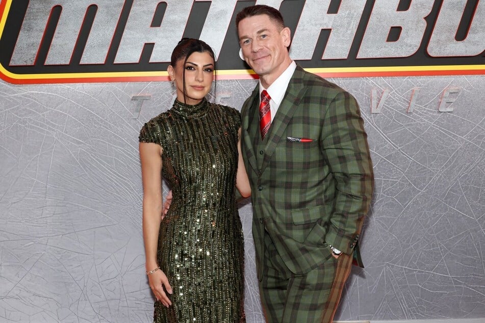 Shay Shariatzadeh (l.) and John Cena attend Apple Original Films' NYC premiere of Matchbox The Movie. The movie, now streaming on Apple TV, follows the reunion of a group of childhood friends.