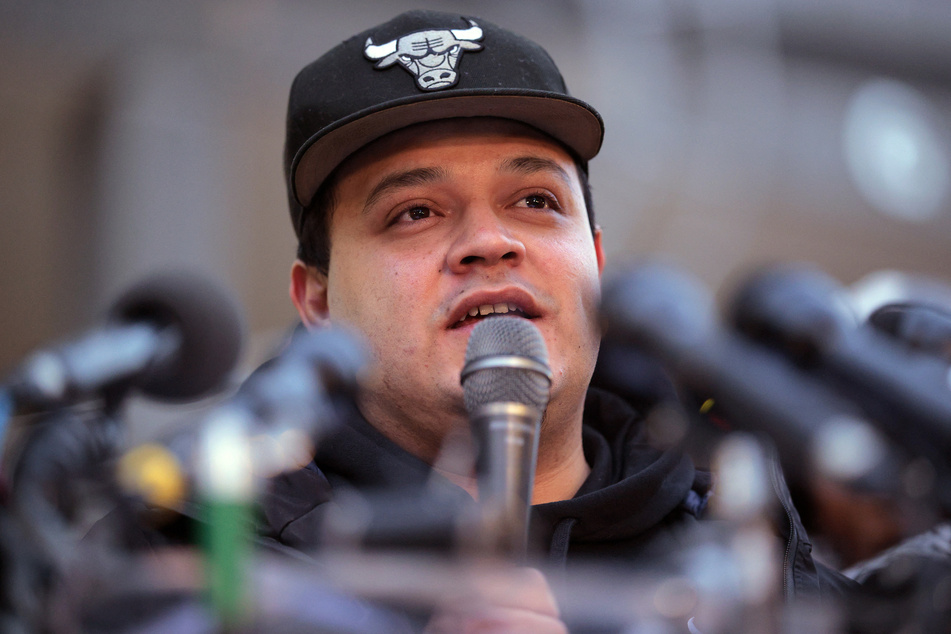 Kilmar Abrego Garcia speaks to supporters as he arrives for his first check-in at the US Immigration and Customs Enforcement Baltimore Field Office on December 12, 2025, the day after a federal judge ordered his release from a detention facility in Pennsylvania.