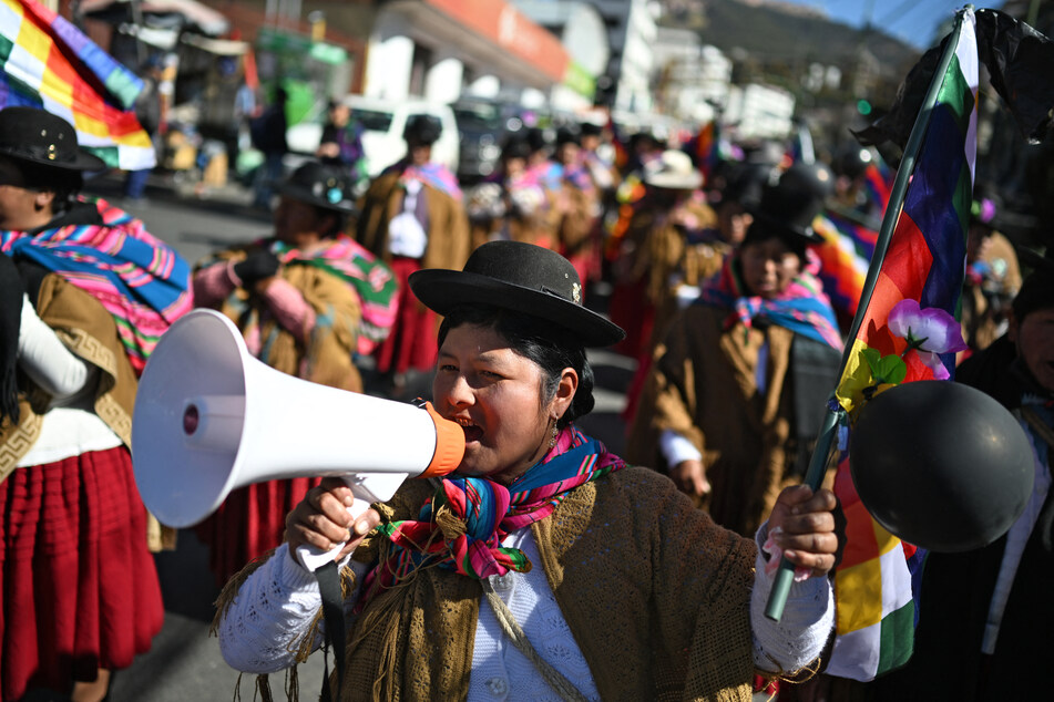 An Indigenous woman uses a megaphone during a protest against the government of President Rodrigo Paz in La Paz, Bolivia, on May 27, 2026.
