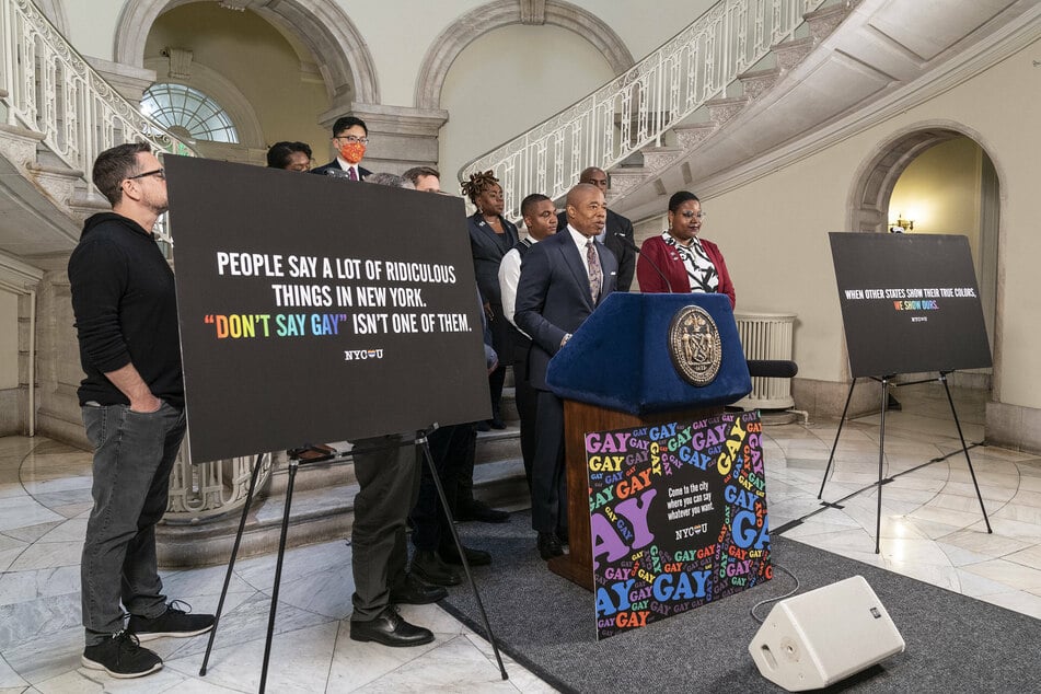 Mayor Eric Adams makes an announcement with LGBTQ+ advocates at City Hall.on Monday.