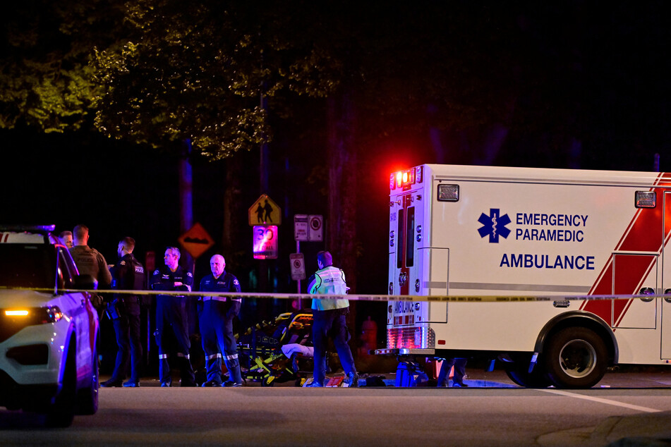 An ambulance is parked at the site of the Lapu Lapu Day festival, where a vehicle drove into a crowd killing several people, in Vancouver, Canada.