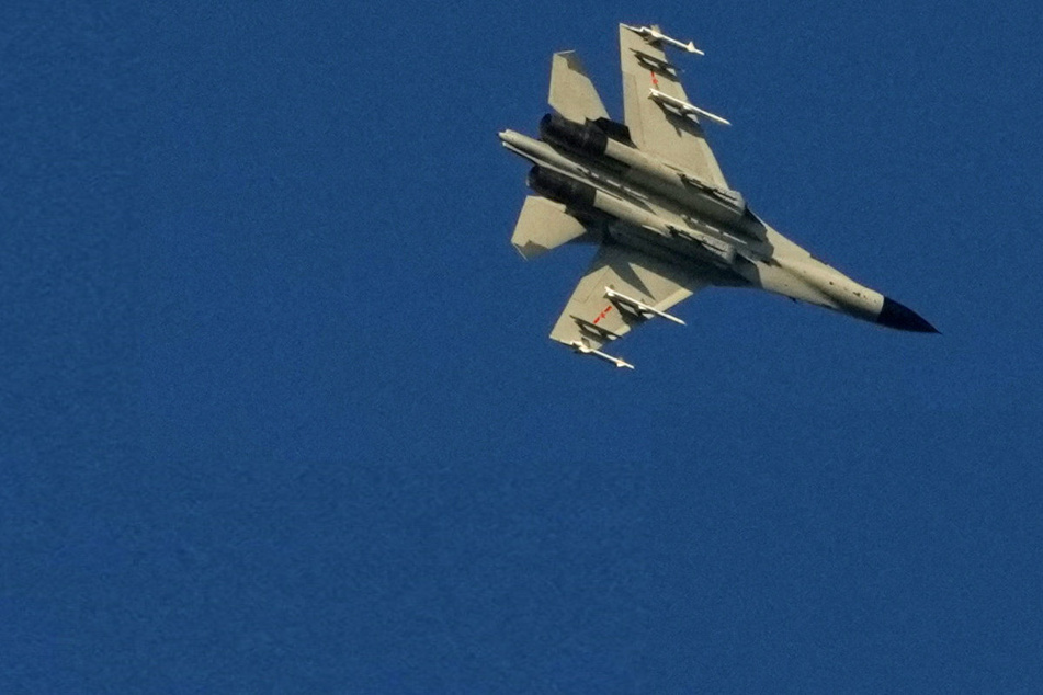 Chinese fighter jets and warships rattle Taiwan as crisis deepens