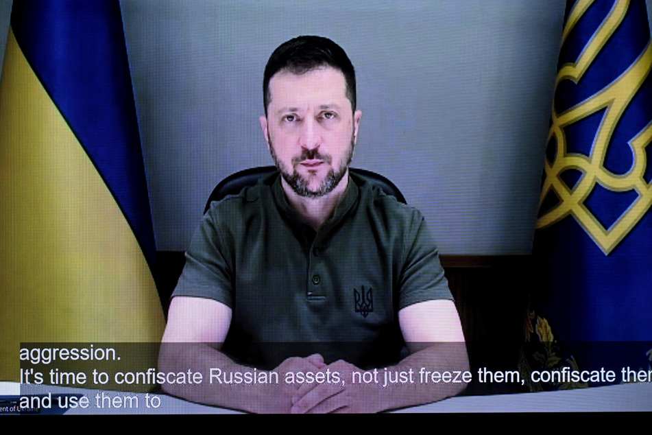 Ukraine's President Volodymyr Zelensky calls for the confiscation of Russian assets during an online address to the opening of the Helsinki+50 Conference in Finland on July 31, 2025.