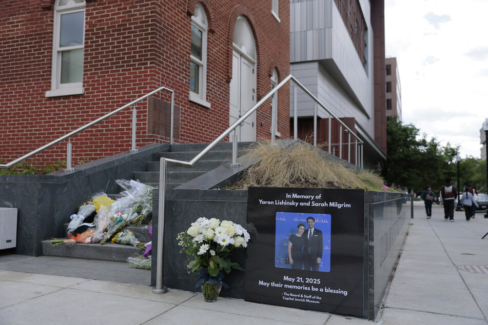 A tribute and flowers for Israeli Embassy staff members Yaron Lischinsky and Sarah Lynn Milgrim are seen outside the Lillian and Albert Small Capital Jewish Museum on May 23, 2025 in Washington, DC.