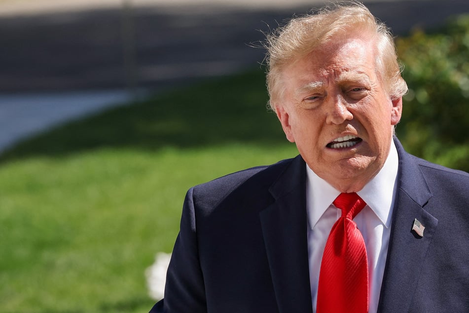 President Donald Trump speaks to the media at the White House on Thursday. The US leader threatened to hit Iran "very hard" if Tehran was found to be responsible for the recent attack on a flydubai flight.