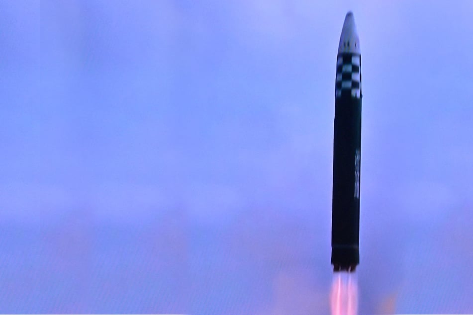 North Korea fires ballistic missile into sea and sounds alarms