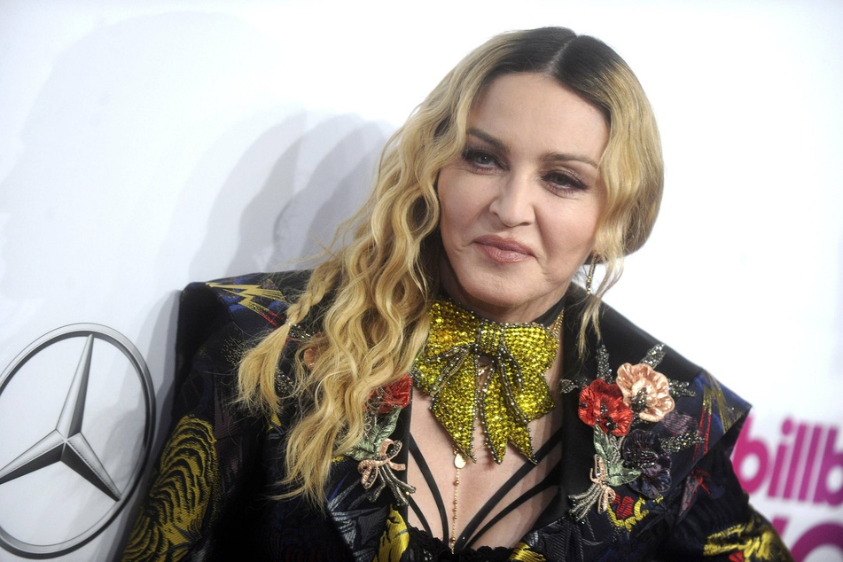 The "very first time" at 62: Madonna gets a tattoo!