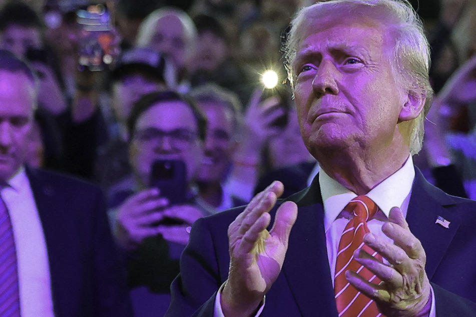 Trump vows to end "American decline" and crack down on immigration at inauguration eve rally