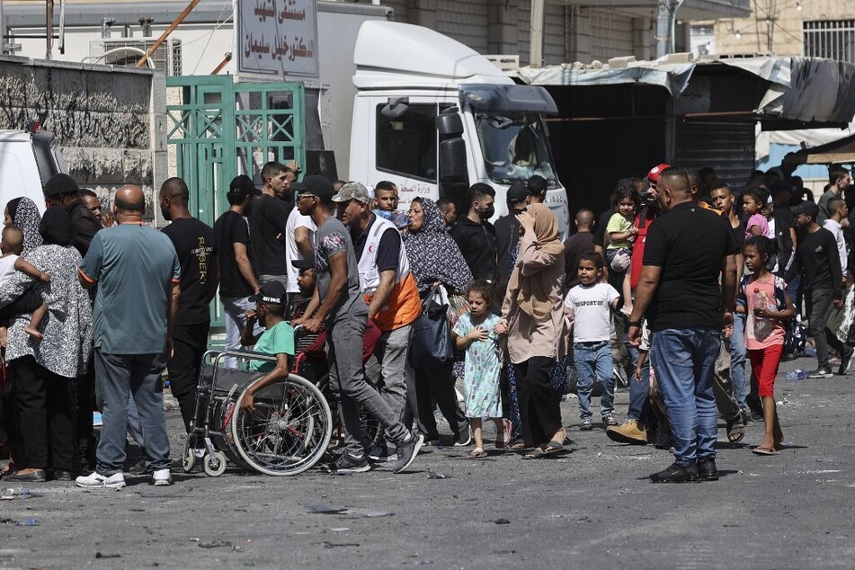 People flee the Jenin refugee camp in the occupied West Bank during an ongoing Israeli military operation.