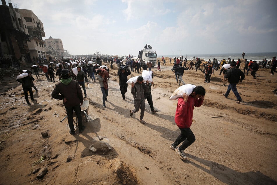 Israel accused of latest massacre of Palestinians gathering for aid