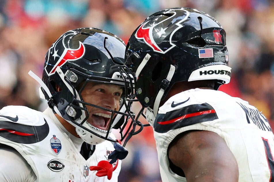 Houston Texans' Jaylin Noel celebrates scoring their third touchdown with Woody Marks at London's Wembley Stadium.