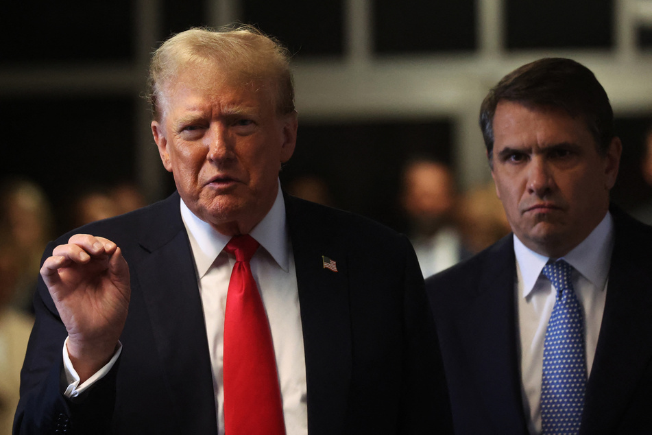 Former US President and Republican presidential candidate Donald Trump (l.) speaks to the media with his attorney Todd Blanche (r.) during his criminal trial for allegedly covering up hush money payments at Manhattan Criminal Court in New York City on Tuesday.