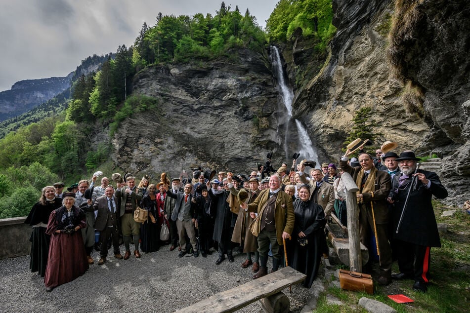 Members of the Sherlock Holmes Society of London pose during their trip to the Reichenbach Falls, near Meiringen, on May 3, 2026.
