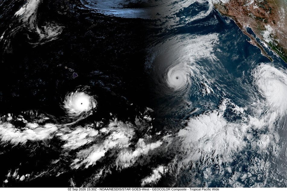 This handout satellite image obtained from the NOAA/GOES shows Hurricane Lowell (L), Hurricane Karina (C), and Tropical Storm Marie (R) over the Pacific Ocean on Wednesday.