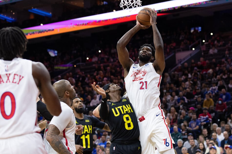 Philadelphia 76ers center Joel Embiid drives for a score past Utah Jazz forward Jarred Vanderbilt during the second quarter at Wells Fargo Center.