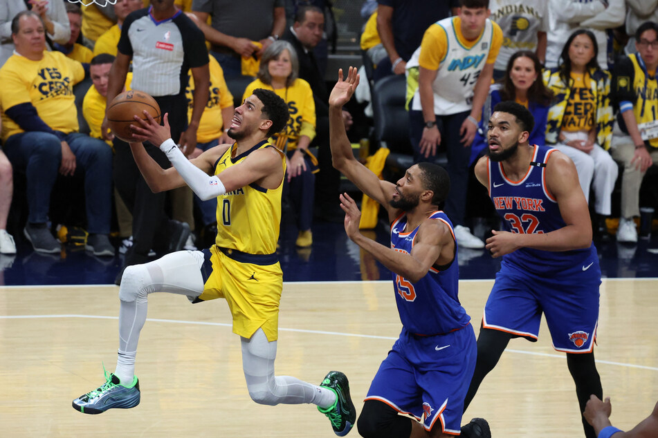 Tyrese Haliburton (l.) produced a triple double to put the Indiana Pacers on the brink of the NBA Finals after their win over the New York Knicks.