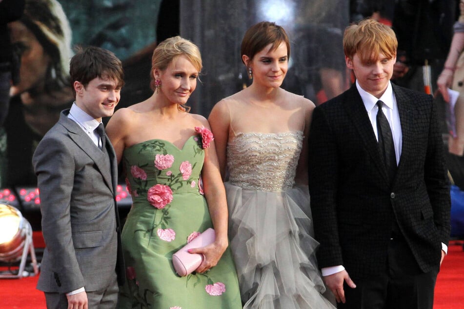 (From l. to r.) Daniel Radcliffe, JK Rowling, Emma Watson, and Rupert Grint pose during the global premiere of Harry Potter and The Deathly Hallows: Part 2 in London, July 7, 2011. The movie stars have all spoken out against Rowling's anti-trans rhetoric.
