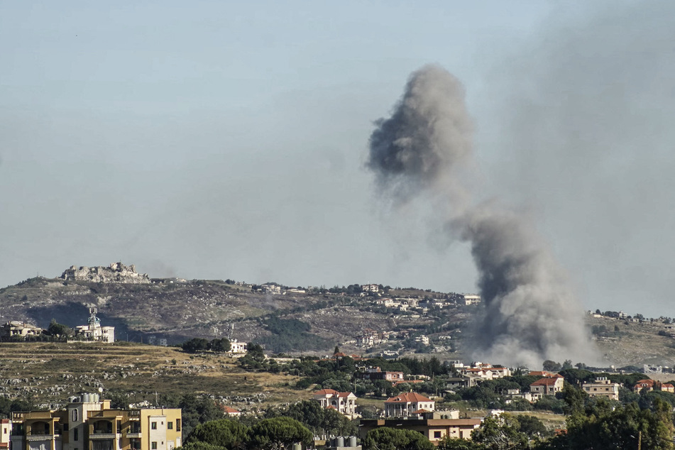 Smoke rises from the site of an Israeli airstrike in the Lebanese village of Nabatieh al-Fawqa, with the Beaufort Castle visible in the background, on June 4, 2026.