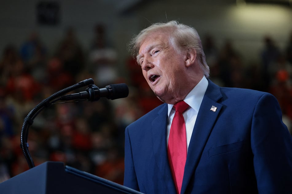 President Donald Trump delivers remarks during a rally ahead of the midterm election in Port Huron, Michigan, on October 25, 2026. During his remarks, he insulted Norway and threatened to deny Norwegian immigrants because he was not awarded the Nobel Peace Prize.