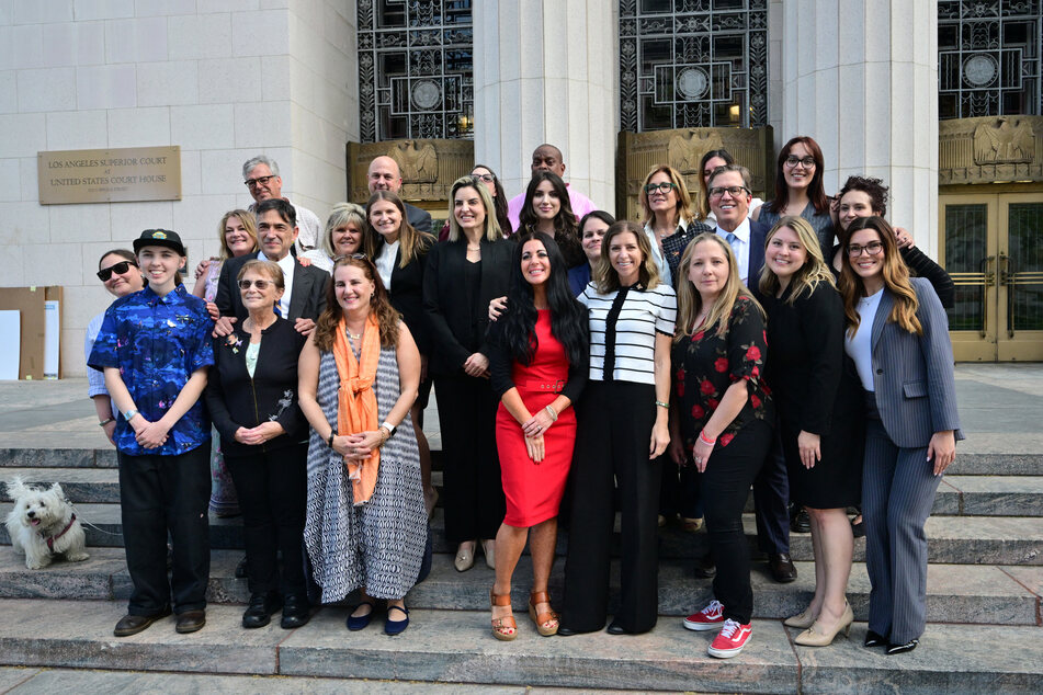 Survivor parents, family members, and lawyers gather outside Los Angeles Superior Court on March 12, 2026, as a trial examines whether social media companies deliberately designed their platforms to be addictive to children.