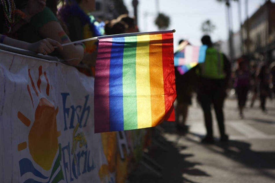 Revelers celebrate on 7th Avenue during the Tampa Pride Parade in the Ybor City neighborhood.
