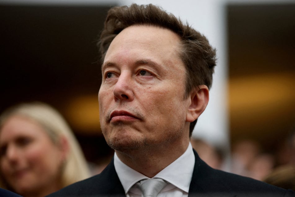 Elon Musk attends the "A New Golden Age" summit at the US Institute of Peace, renamed The Donald J. Trump Institute of Peace by the Trump administration, on October 8, 2026. The tech billionaire has promised to give every child in the US a share in his SpaceX rocket company.