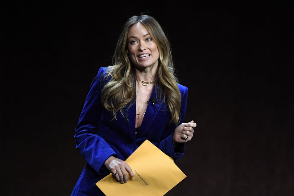 Olivia Wilde said she broke down in tears after getting served custody papers on stage at CinemaCon.